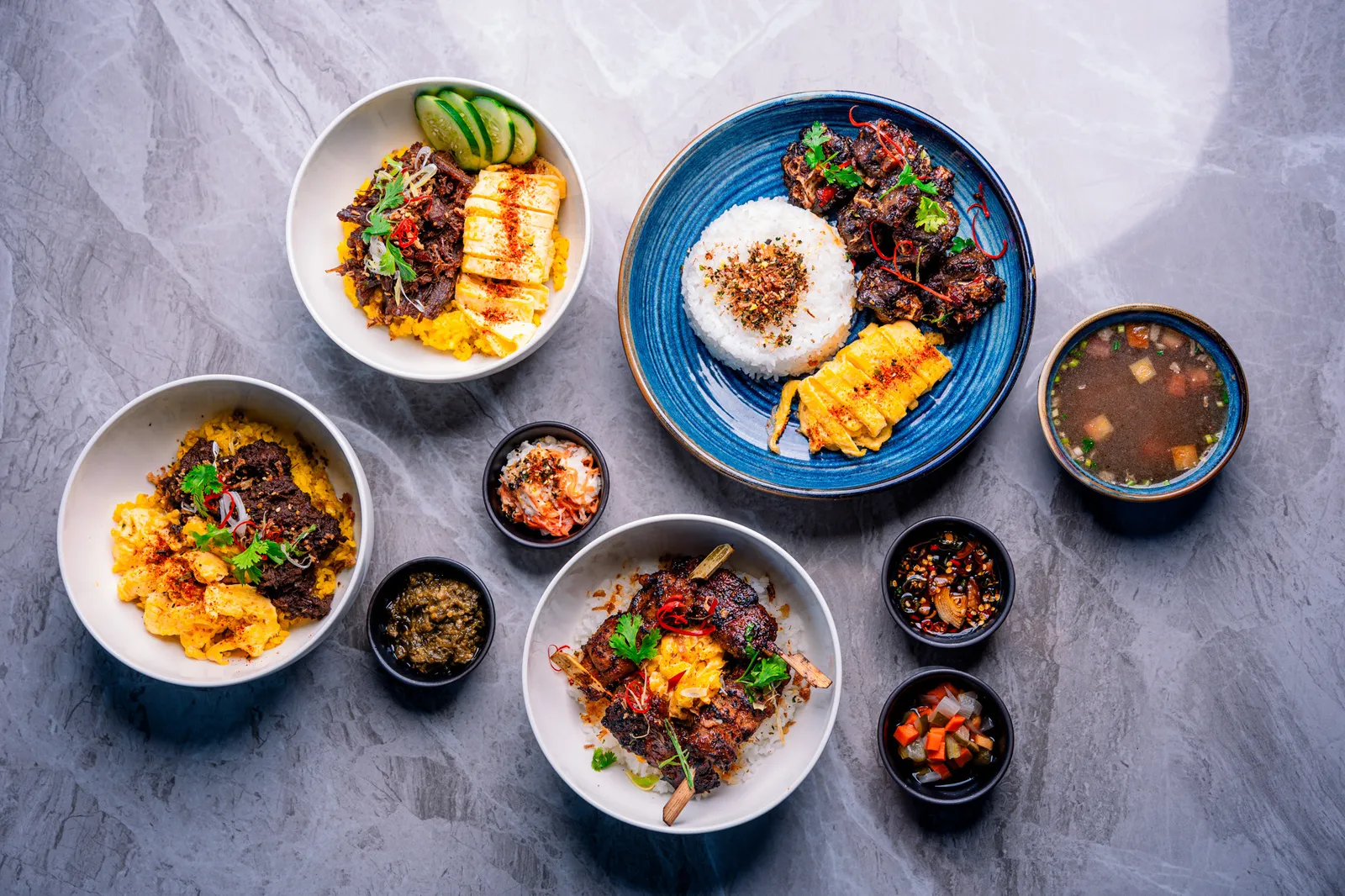 Bobi Bowl catering spread: sharing bowls, satay and sambal
