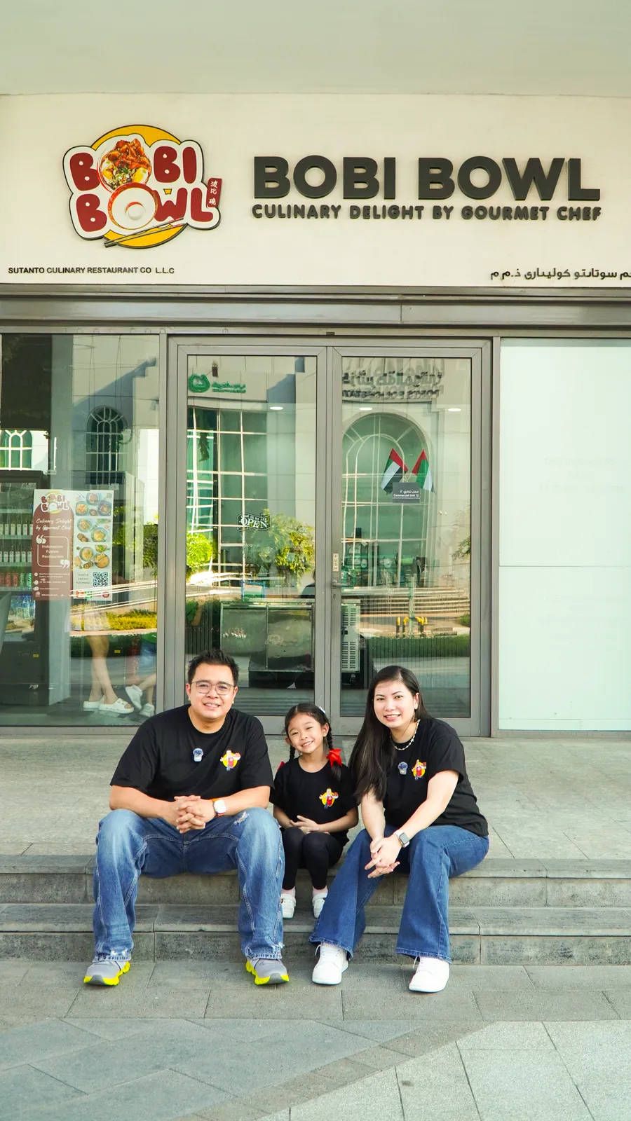 Chef Bobby Sutanto and Sylvana Sari with their family in front of Bobi Bowl
