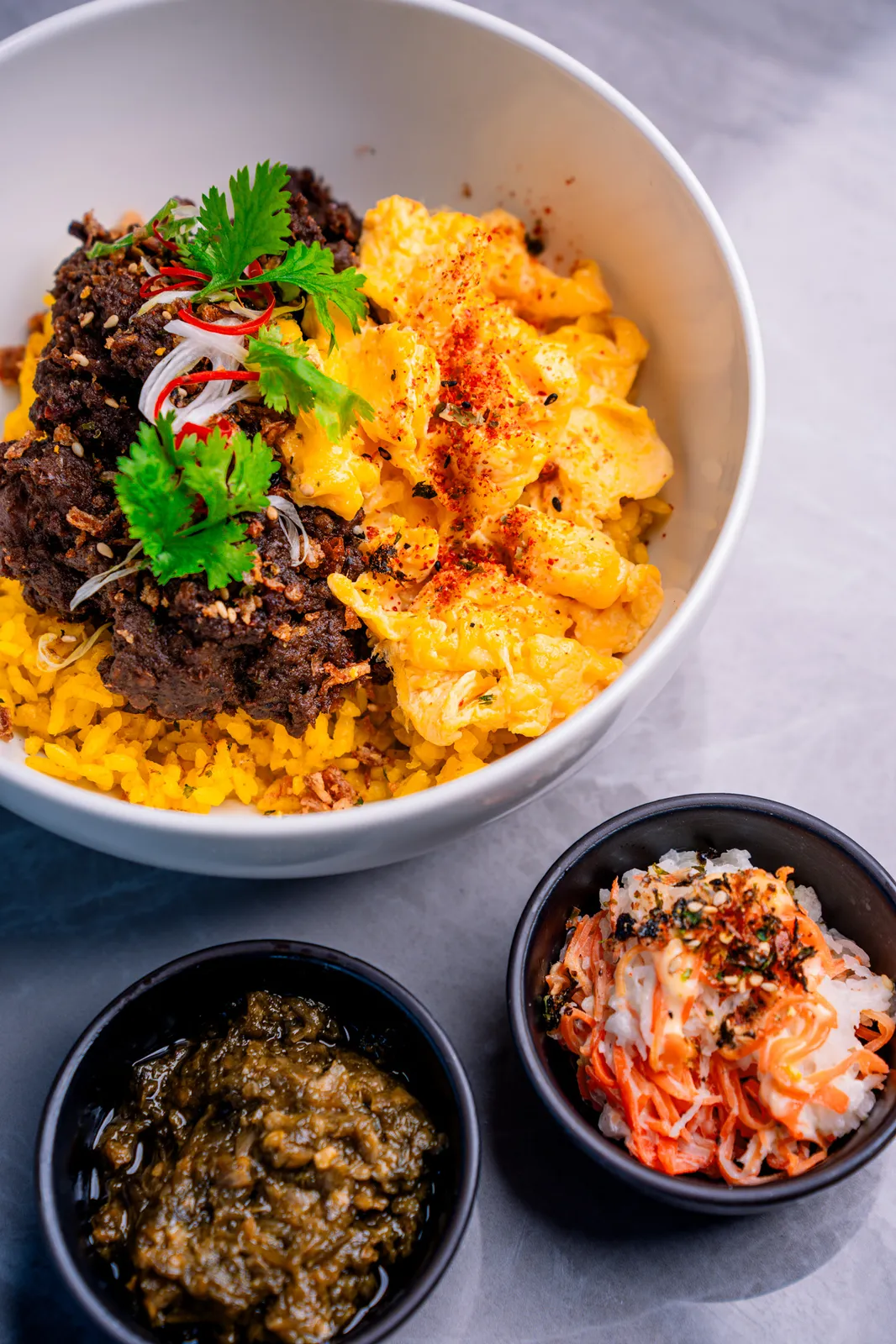 Beef rendang bowl with sambal and pickles