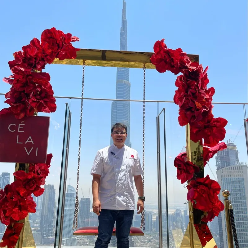 Chef Bobby Sutanto on the Ce La Vi Dubai terrace with the Burj Khalifa behind