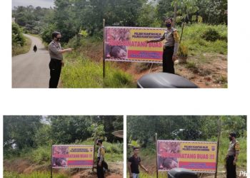 Polsek Kuantan Hilir memasang Banner himbauan kepada masyarakat terkait bahaya binatang buas