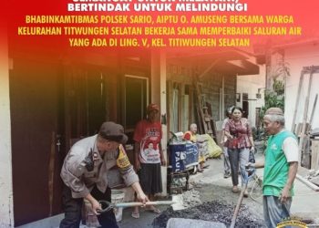 Bhabinkamtibmas Polsek Sario Polresta Manado Aiptu O. Amuseng turun langsung membantu masyarakat memperbaiki saluran air di Kelurahan Titiwungen