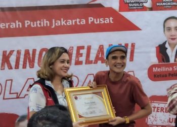 Meilina Siregar (kiri) bersama dengan Rinaldi Usman (kanan)
