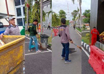 Para pahlawan kebersihan membuat Markas Polda Sumsel terlihat berseri