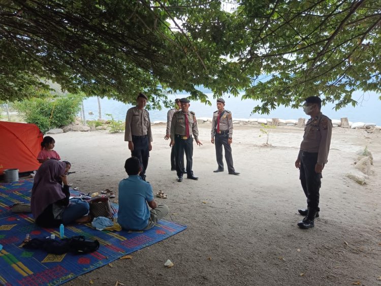 Kasat Pam Obvit Polres Dairi AKP LP Sinaga bersama Personil Sat Pengaman Objek Vital (Sat Pam Obvit) Polres Dairi melaksanakan kegiatan patroli di objek wisata DPSP ( Distinasi Pariwisata super prioritas) Tao Silalahi