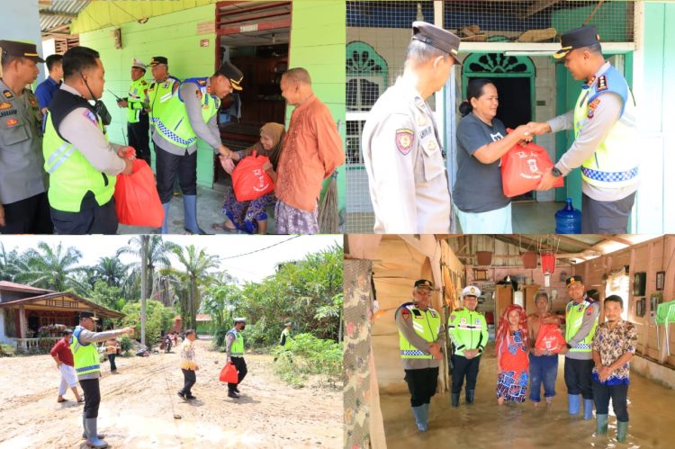 Kapolres Labuhanbatu, AKBP James H. Hutajulu, SIK., SH., MH., MIK. memberikan bantuan sembako kepada masyarakat yang menjadi korban banjir di Jalinsum Kel. Bandar Durian