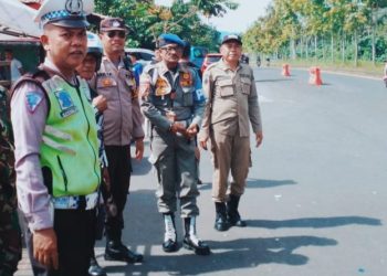 Personel Polsek Mapanget Polresta Manado bersama instansi terkait melaksanakan pengamanan Drag Race yaang dilaksanakan di wilayah hukum Polsek Mapanget