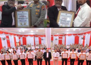 Kapolres Labuhanbatu AKBP James H. Hutajulu dan Bupati Labuhanbatu Utara Hendrianto Sitorus menerima penghargaan dari Komnas Perlindungan Anak (Komnas PA).