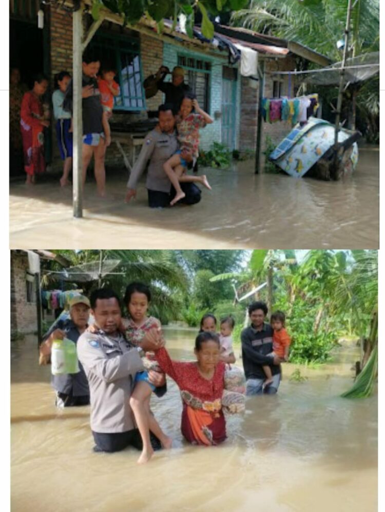Tampak Aiptu Ponirin menolong dan memapah seorang nenek dan anak kecil dari genangan air ke tempat yang tidak tergenang