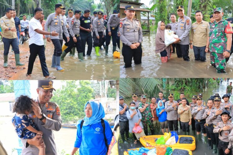 Kapolres Labuhanbatu AKBP James H. Hutajulu beserta Personil turun ke lokasi banjir di Kampung Jati Kecamatan Bilah Hilir, Kabupaten Labuhanbatu, Sumatera Utara.