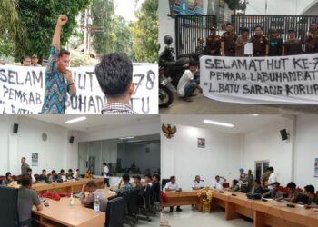 Sejumlah masyarakat dan mahasiswa yang tergabung dalam Aliansi Masyarakat Mahasiswa Peduli Hukum (AMMPUH) Kabupaten Labuhanbatu melakukan aksi unjuk rasa di depan Kantor Bupati Labuhanbatu, Kejari Labuhanbatu dan Mapolres Labuhanbatu, Rabu (18/10/2023) siang.