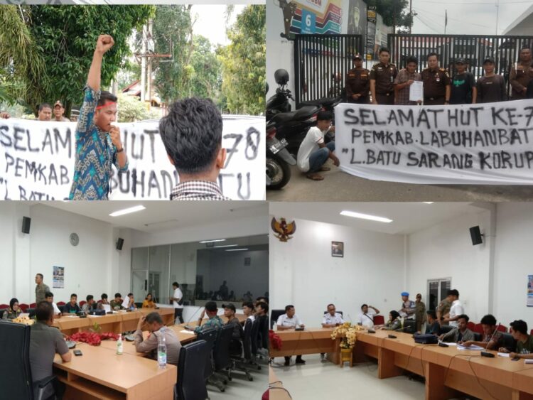 Sejumlah masyarakat dan mahasiswa yang tergabung dalam Aliansi Masyarakat Mahasiswa Peduli Hukum (AMMPUH) Kabupaten Labuhanbatu melakukan aksi unjuk rasa di depan Kantor Bupati Labuhanbatu, Kejari Labuhanbatu dan Mapolres Labuhanbatu, Rabu (18/10/2023) siang.