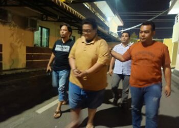 6 TAHUN PENJARA: Tiktoker berinisial FM yang diduga melakukan penghinaan terhadap Agama Kristen ditahan di Polrestabes Medan dan terancam 6 tahun penjara.(Foto Dok/Polrestabes)
