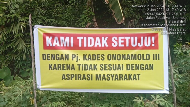 Sejumlah titik di Desa Ononamolo lll, Kecamatan Mandrehe Barat, Kabupaten Nias Barat terpasang spanduk penolakan Pj kades, yang tertulis "Kami tidak setuju pj kades ononamolo lll karena tidak sesuai dengan aspirasi masyarakat" masyarakat sebut, bupati pilih orang-orangnya dan bukan karena kepentingan masyarakat. Selasa (02/01/2024).