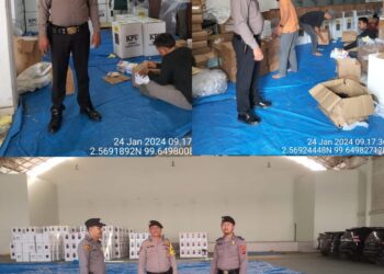 Personel Polres Labuhanbatu melaksanakan pengamanan Gudang Logistik, Pengesetan, Pengepakan dan Pengemasan Logistik pemilu 2024 oleh KPU Kab. Labuhanbatu Utara, Rabu (24/01/2024).