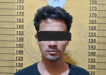 DIAMANKAN : M (27), terduga pelaku penganiayaan, diamankan di Polsek Tanjungberingin. (Foto Dok/Humas Polres)