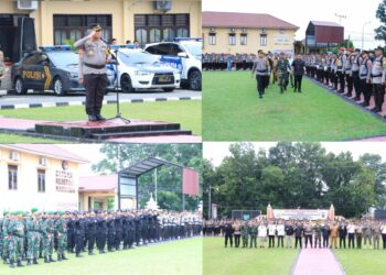 Kapolres Labuhanbatu AKBP Dr. Bernhard L. Malau, S.I.K., M.H., memimpin apel pergeseran pasukan (serpas) dalam rangka kesiapan pengamanan tahap pemungutan dan penghitungan suara di TPS pada Pilkada Serentak 2024. Apel berlangsung di lapangan Polres Labuhanbatu, Jalan MH Thamrin, Rantau Utara, pada Senin pagi (25/11/2024) pukul 08.00 WIB.
