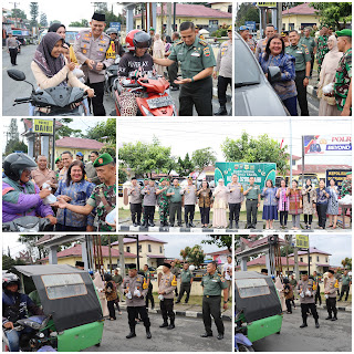 Polres Dairi bersama Kodim 0206 Dairi menggelar aksi sosial berbagi takjil kepada pengguna jalan di depan Polres Dairi, Jl. SM Raja, Kecamatan Sidikalang, Kabupaten Dairi, pada Kamis (28/3/2025).