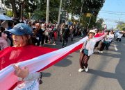 Nyalakan Nasionalisme, Merah Putih Sepanjang 100 Meter Terbentang di Karnaval Paskah Kota Semarang