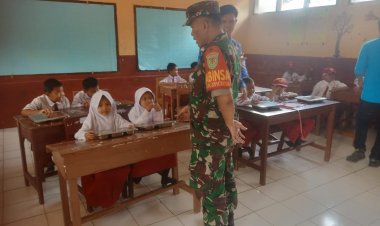 Babinsa Koramil 2201/Cisolok Dampingi Pendistribusian Makanan Bergizi di SDN Gadog