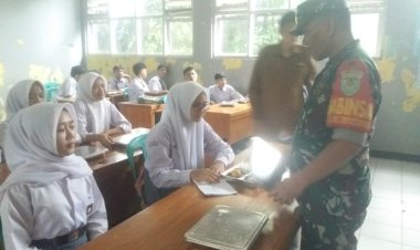 Babinsa Koramil 2201/Cisolok Dampingi Pendistribusian Makanan Bergizi di SMAN 1 Cikakak