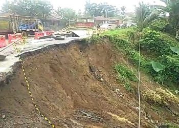 Sebagian badan Jalan Jamin Ginting, km 23, Desa Tiang Layar, Kecamatan Pancurbatu, Deliserdang terancam putus. (Foto: istimewa)
