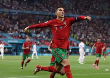 Ekspresi striker Portugal, Cristiano Ronaldo usai membobol gawang Prancis lewat titik penalti di pertandingan terakhir grup F Euro 2020. (Foto: Bernadett SZABO/AFP)