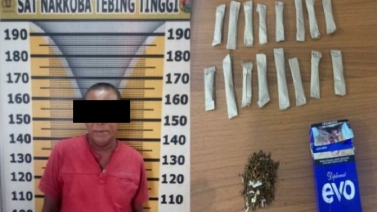 Tersangka BS alias RUM saat diamankan petugas di Mapolres Tebingtinggi. (Foto: Antara/istimewa)