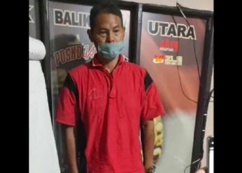 Tersangka M Ali (48) sopir truk kontainer penyebab kecelakaan maut di Simpang Muara Rapak, Balikpapan Kalimantan Timur ternyata menggunakan SIM palsu. Foto/iNews TV/Mukmin Azis
