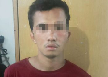 Foto pelaku saat diamankan di Polres Pematangsiantar.