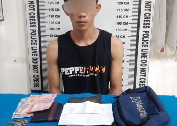Foto pelaku Sandi Sanjaya alias Kakang saat di kantor Polisi.