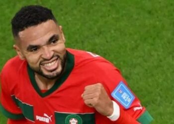 Penyerang Maroko #19 Youssef En-Nesyri merayakan golnya pertandingan sepak bola perempat final Piala Dunia Qatar 2022 antara Maroko dan Portugal di Stadion Al-Thumama di Doha pada 10 Desember 2022. NELSON ALMEIDA / AFP
