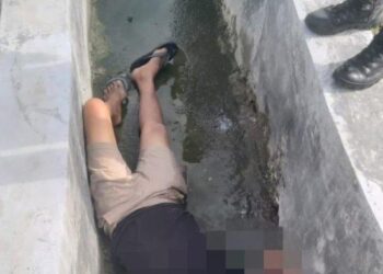 Jenazah Nelson Napitupulu (52), warga Napitupulu Bagasan, Kecamatan Balige, Kabupaten Toba ditemukan dalam kondisi tidak bernyawa di dalam parit di Jalan FL Tobing, Kecamatan Balige, Kabupaten Toba, Minggu (12/2/2023). ISTIMEWA