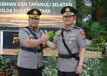 Kapolres Simalungun yang baru, AKBP Choky Sentosa S. Meliala, S.I.K., S.H., M.H., resmi menerima tongkat kepemimpinan.