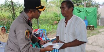 Kapolres Siantar serahkan bantuan kepada keluarga korban