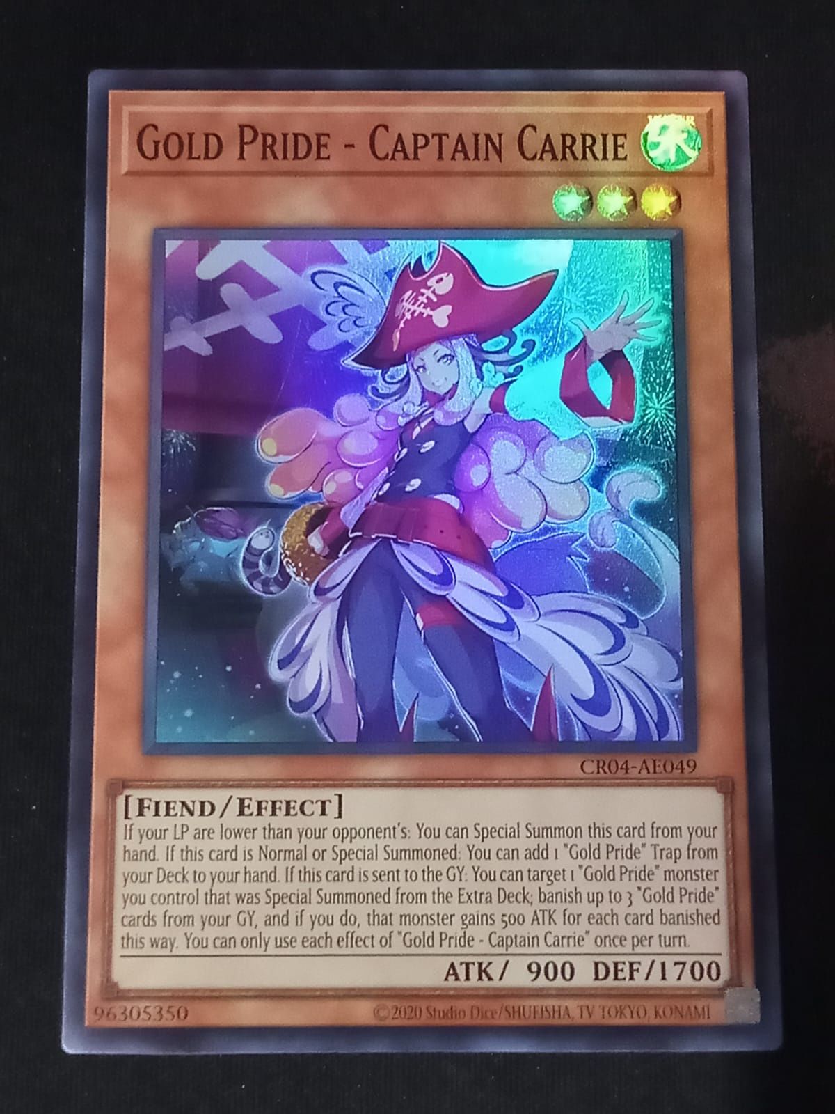 CR04-AE049 Gold Pride - Captain Carrie Super Rare