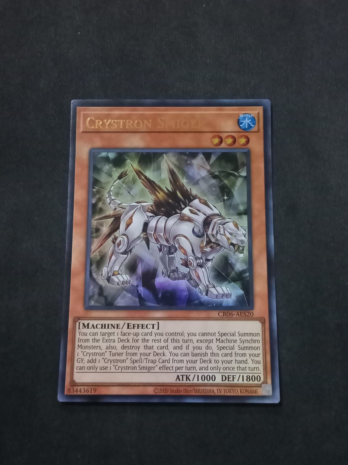 CR06-AE077 Crystron Smiger Ultra Rare